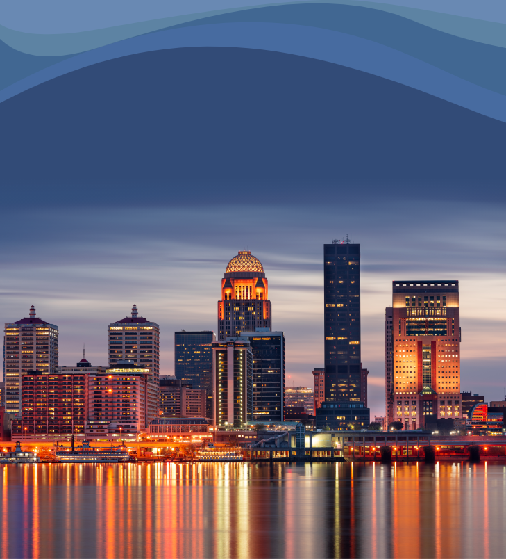 Louisville, Kentucky night time city skyline with city lights reflecting down across a body of water